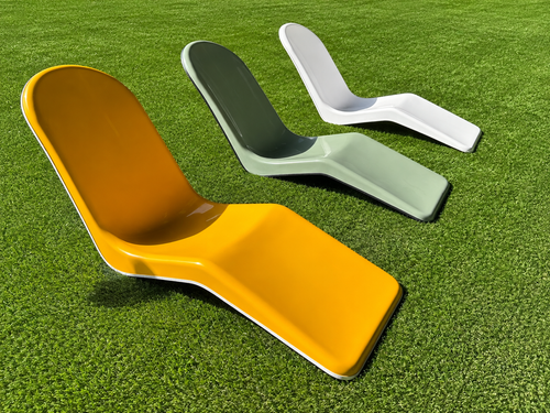 Immersa vintage fiberglass lounge chairs on green turf
